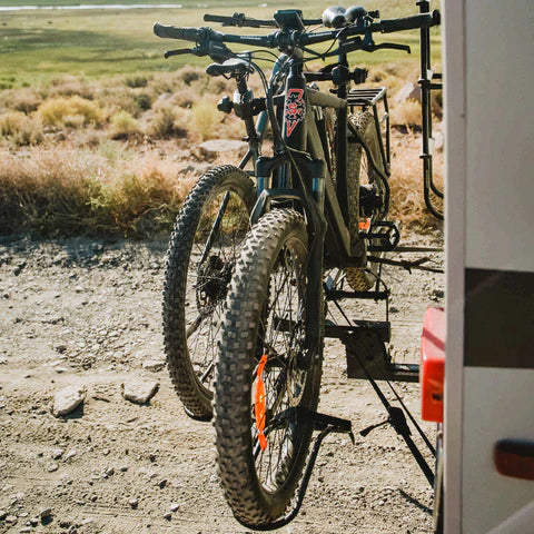 Two e-bikes secured on an RV hitch rack